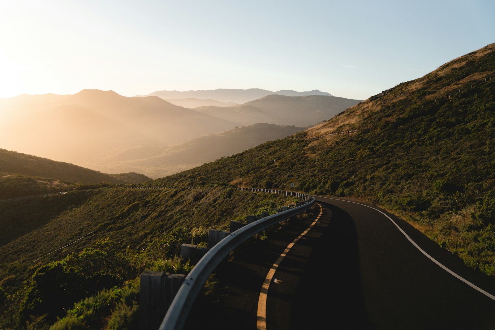Winding road through a mountain range at sunset, for a Pulse Report on @FreddyLA7's World Cup road trip