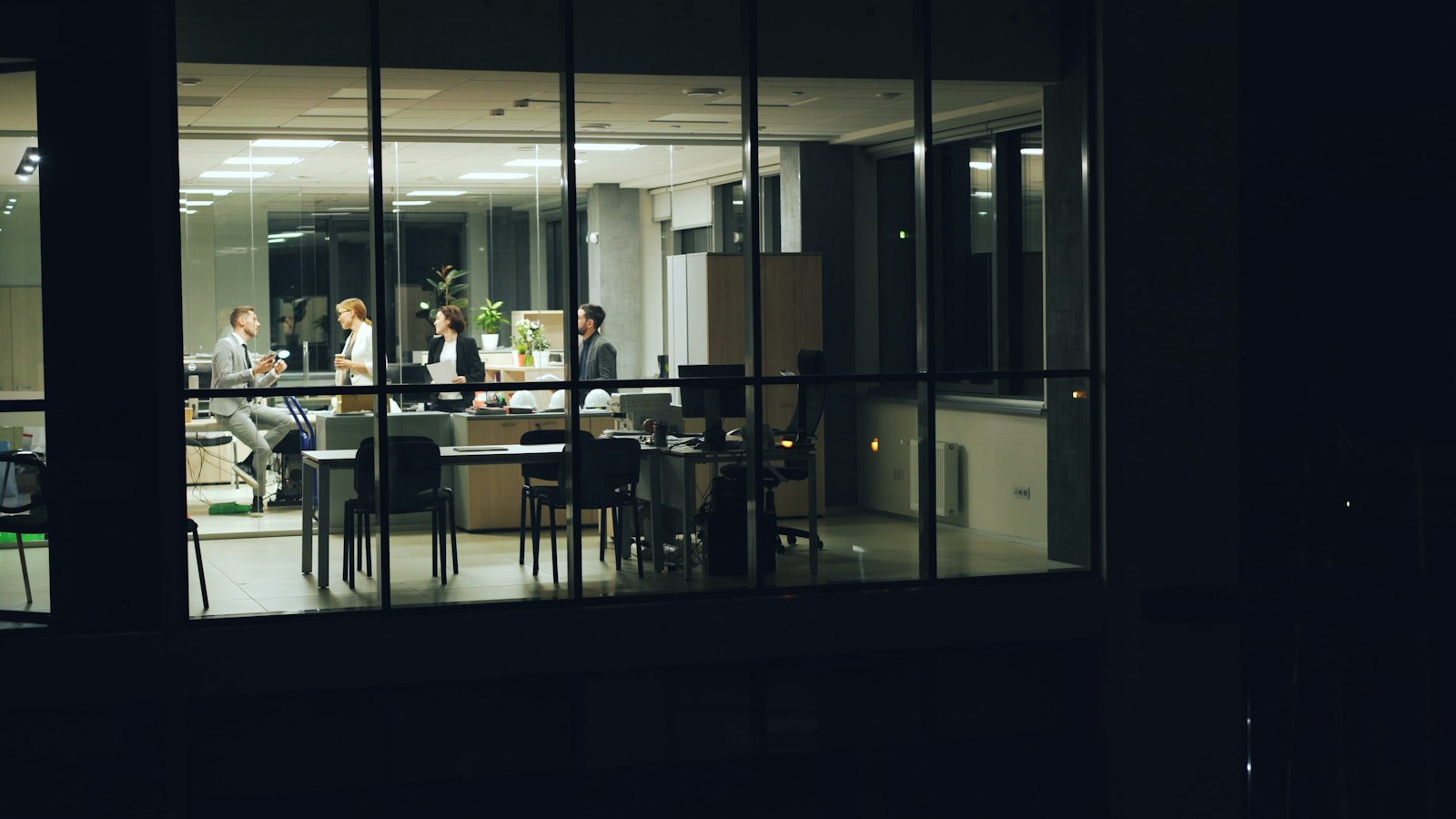 People working late in a modern office at night, for a Pulse Report on Hulu's Not Suitable for Work